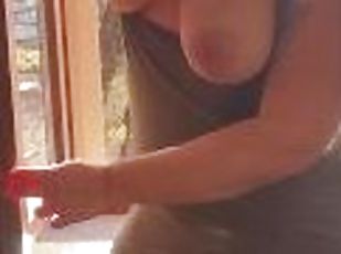 Exhibitionist wife cleaning windows topless. Sexy milf flashing boobs on window. Flashing neighbors