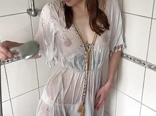 Cools off her horniness in the shower