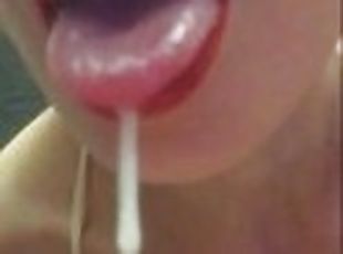 The whore licks the sperm after handjob.