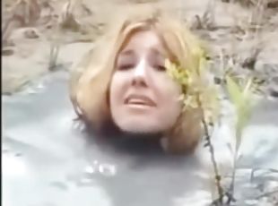 Crazy Bizarre Fetish Fully Clothed MILF In Big Puddle Of Liqued Dirt