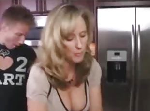 Horny stepson seduces his beautiful stepmom at the kitchen