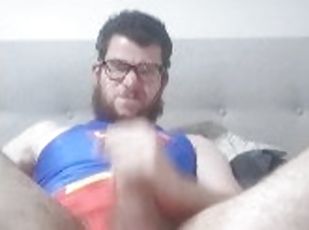 man masterbates in a superman one piece swimsuit