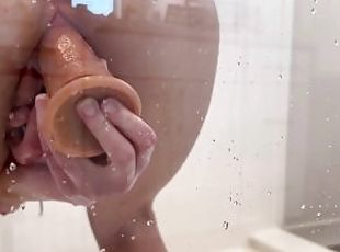 Masturbating with my clear dildo on the shower door ????