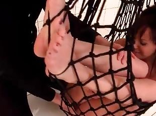 Teen girl caught in a net and sucking dick