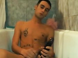 Amateur twink fucks with vibrating black dildo in bathtub